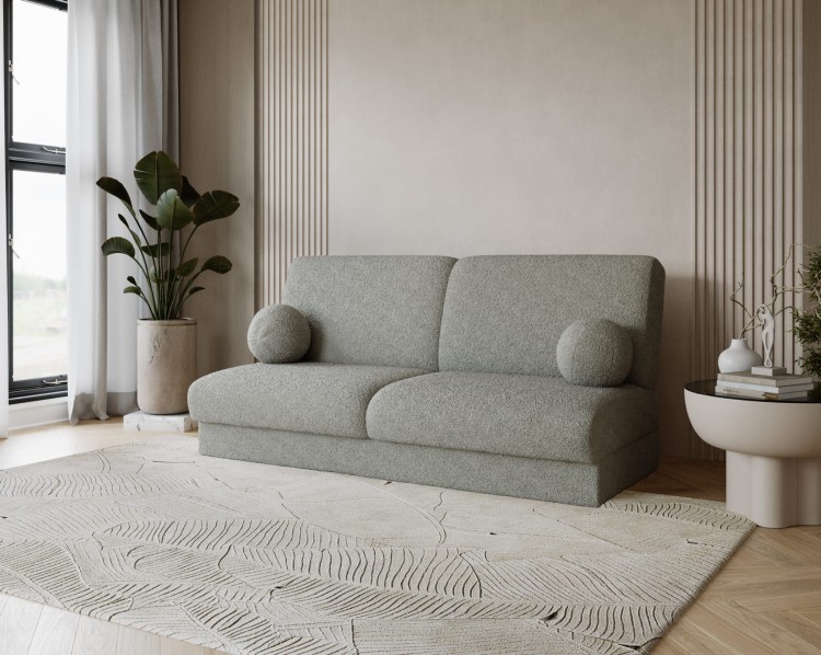 Sofa z tkaniny bukla LUMENA w salonie w stylu japandi i minimalistycznym.